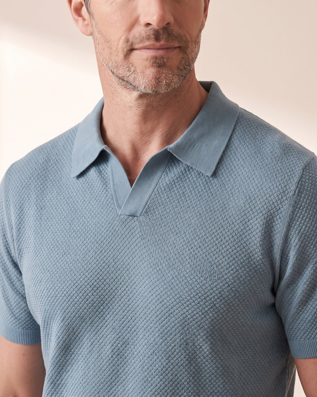 KEPT Men's V-Neck Polo - Capri in muted teal, detail close-up