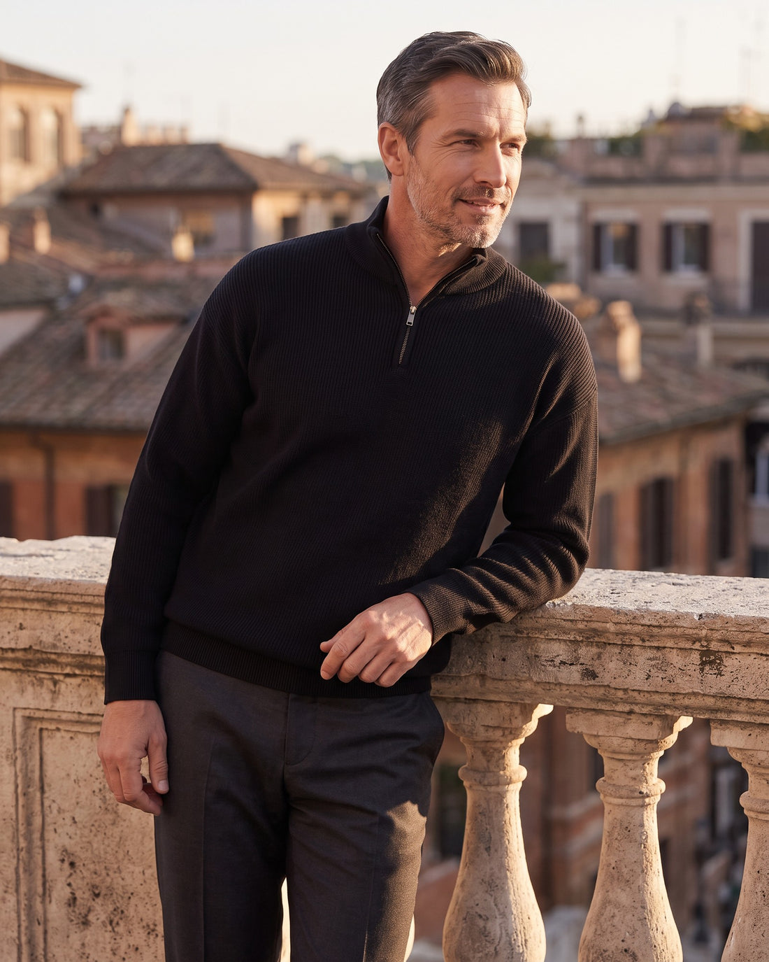 KEPT Men's Half-Zip Sweater - Bruges in black, worn on a terrace