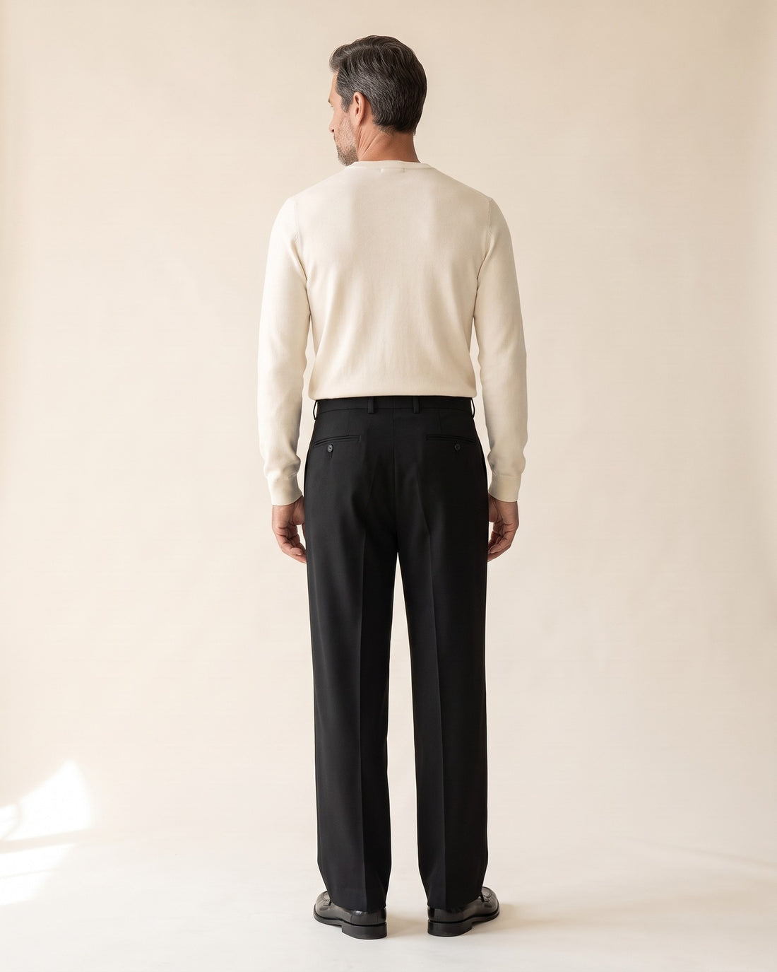 KEPT Men's Pleated Pants - Gunsan in black, back view